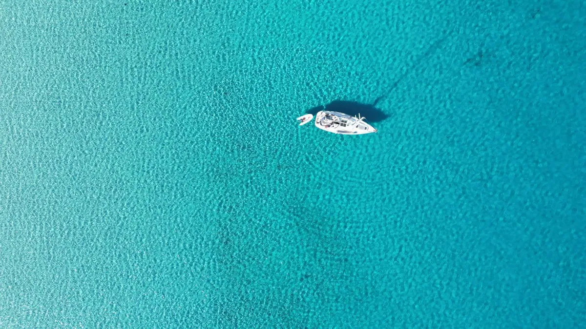Underwater view of posidonia seagrass meadows in crystal-clear turquoise water at anchor in the Agriates
